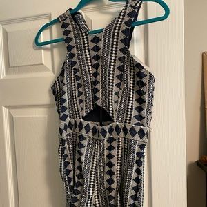 Beautiful cut out navy and ivory and romper!